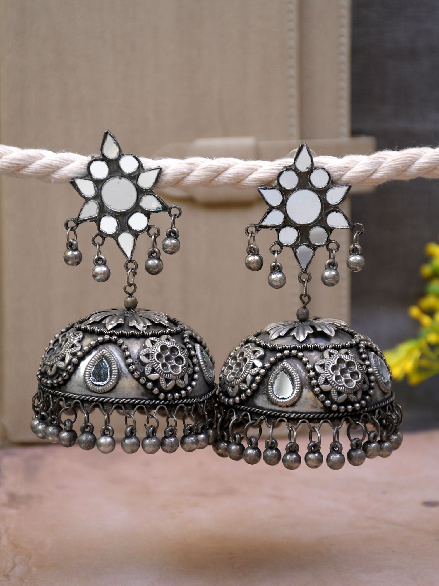 Silver Sheen: Exquisite Oxidised Jhumka Earrings with Grandiose Designs